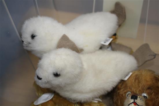 A group of assorted soft toys including teddy bears